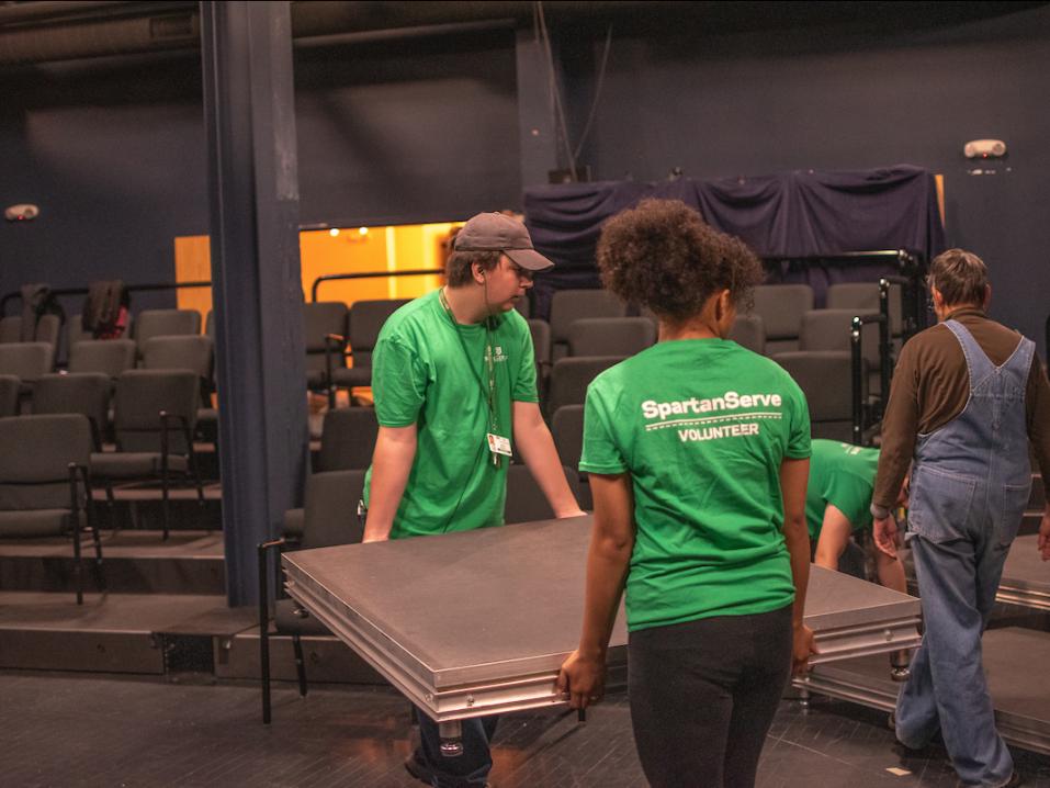 SpartanServe volunteers helping at a local theatre.