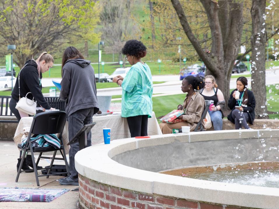 Students near a fountain on Earth Day