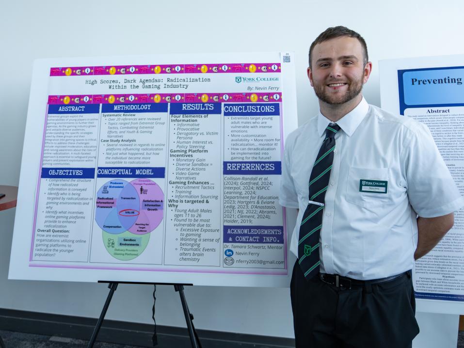 Nevin Ferry stands next to his Undergraduate Research Showcase presentation 