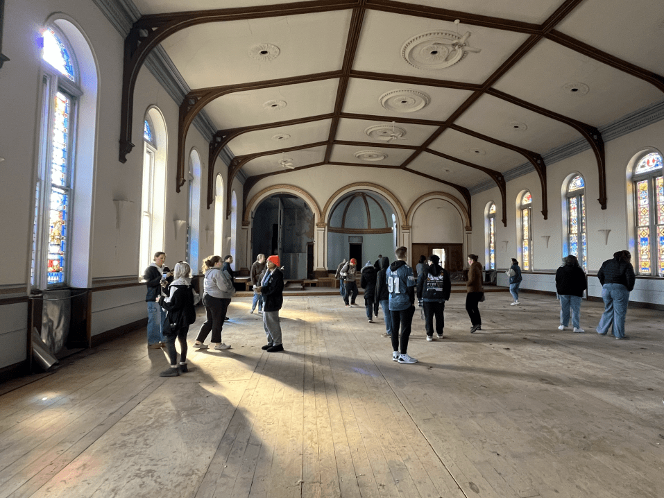 Museum Studies students learning about historic Zion Lutheran Church in downtown York for a research project.