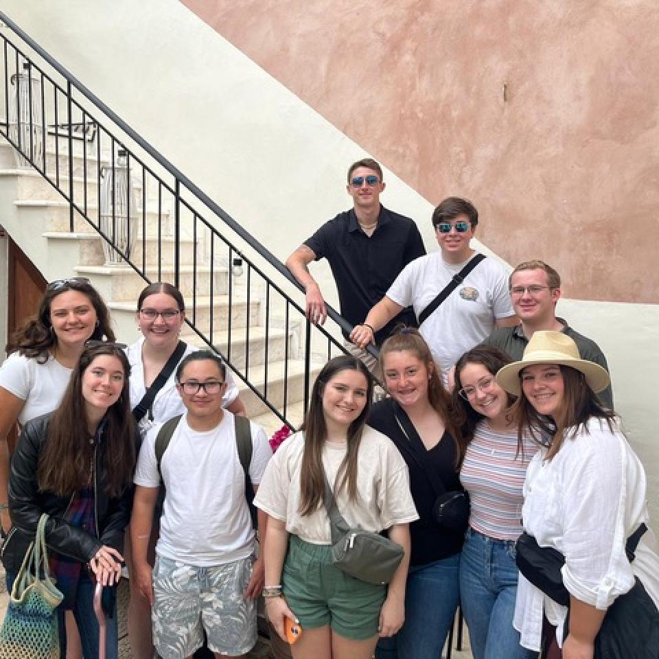 Gia Levis among a group of Graham Fellows smile for a picture while in Greece.