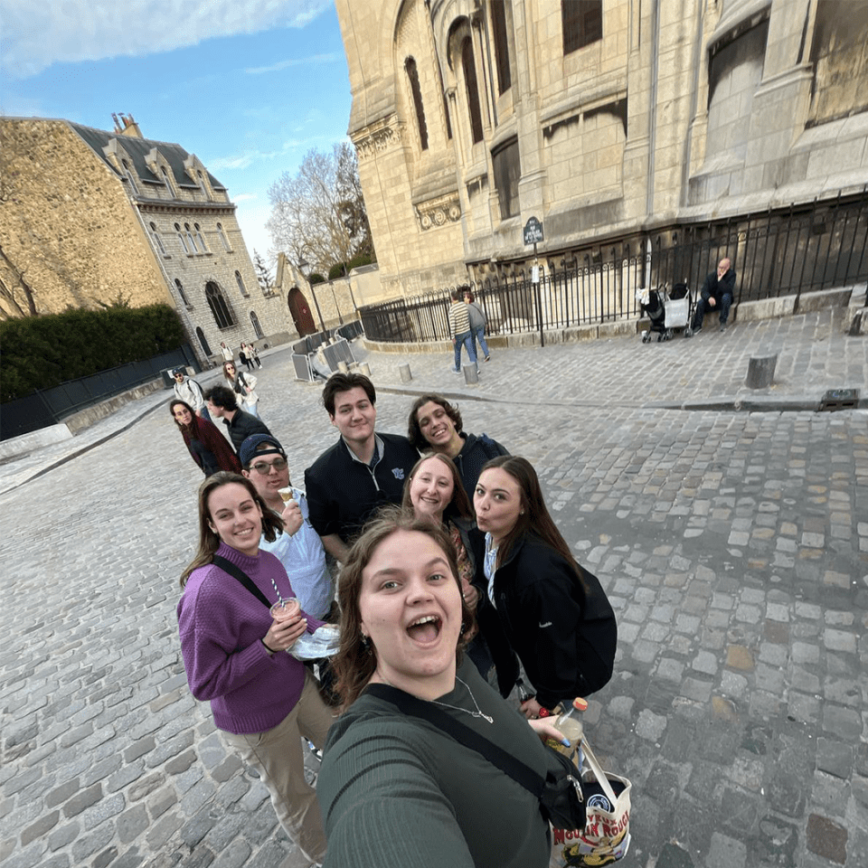 A group of students from the International Sport and Entertainment course at York College take a selfie on a European street.