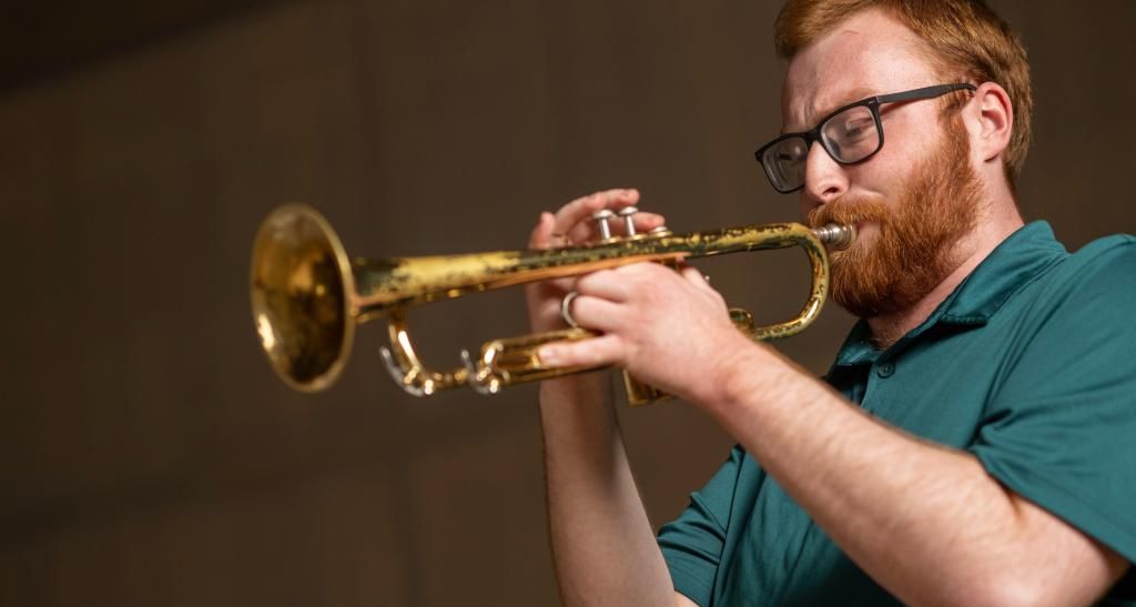 A student plays a trumpet.