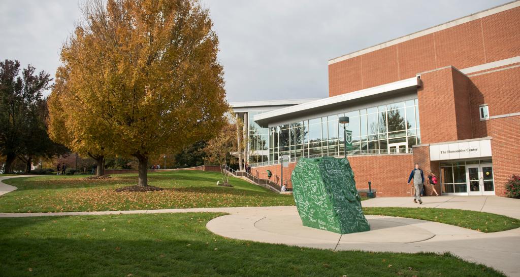 Ol Spart, a green boulder covered in alumni signatures, sits in the center of campus.