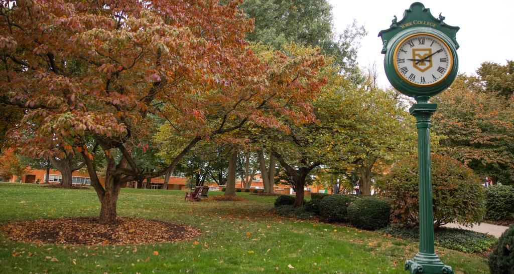 Fall foliage on campus with green campus clock