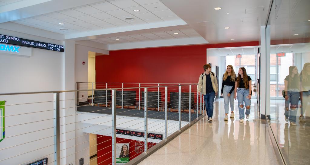 Students walk on upper level of the Willman Business Center