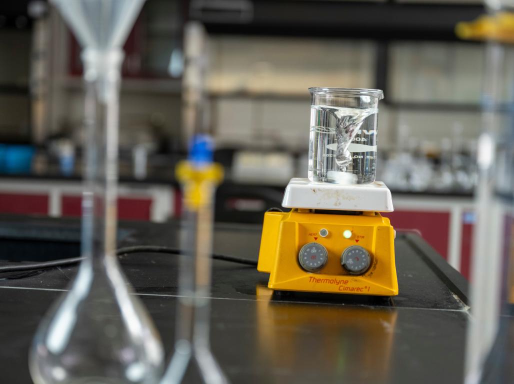 A beaker in a biology lab full of water.