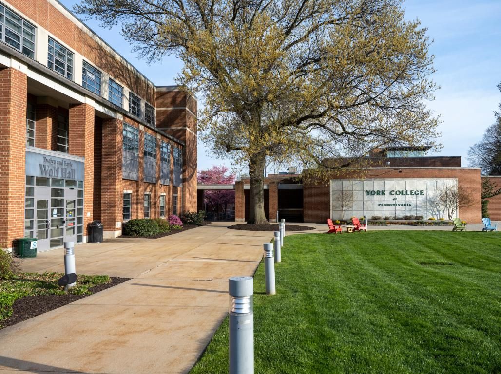 The main York College of PA sign next to Wolf Hall.