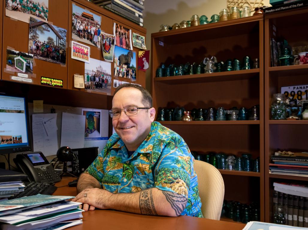 David Fyfe sitting at desk