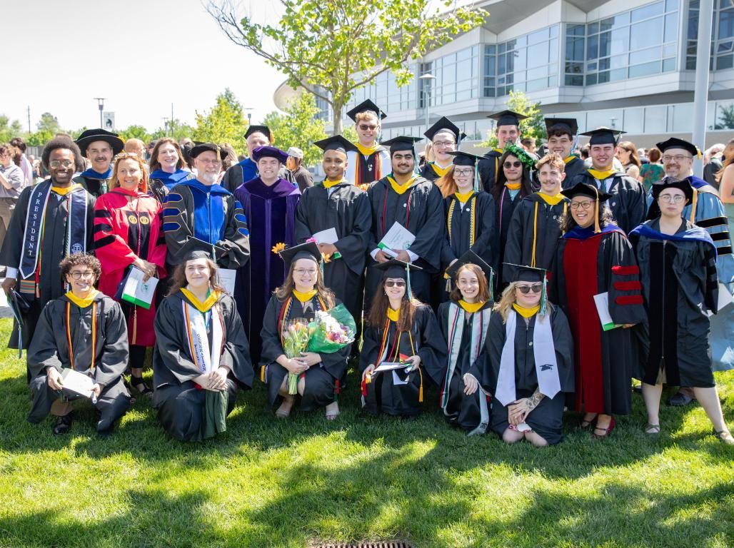 Biology Department Graduates stand together for a group photo