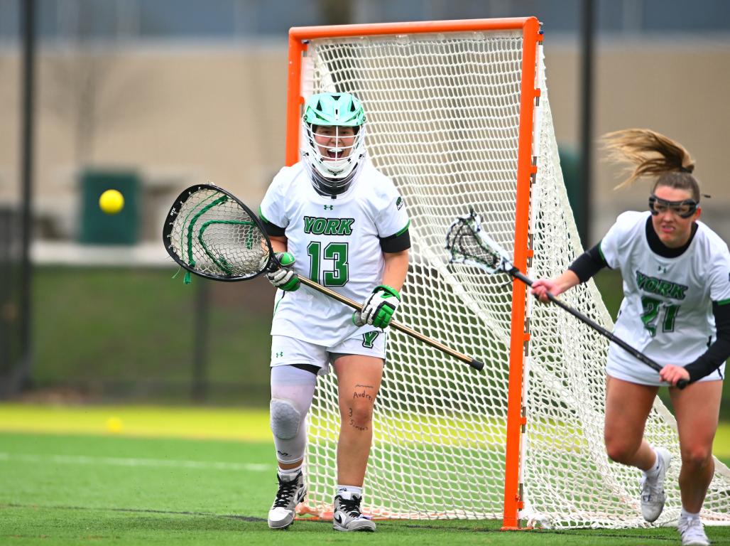 Women's Lacrosse player Bella Garbo guards the net as goalie