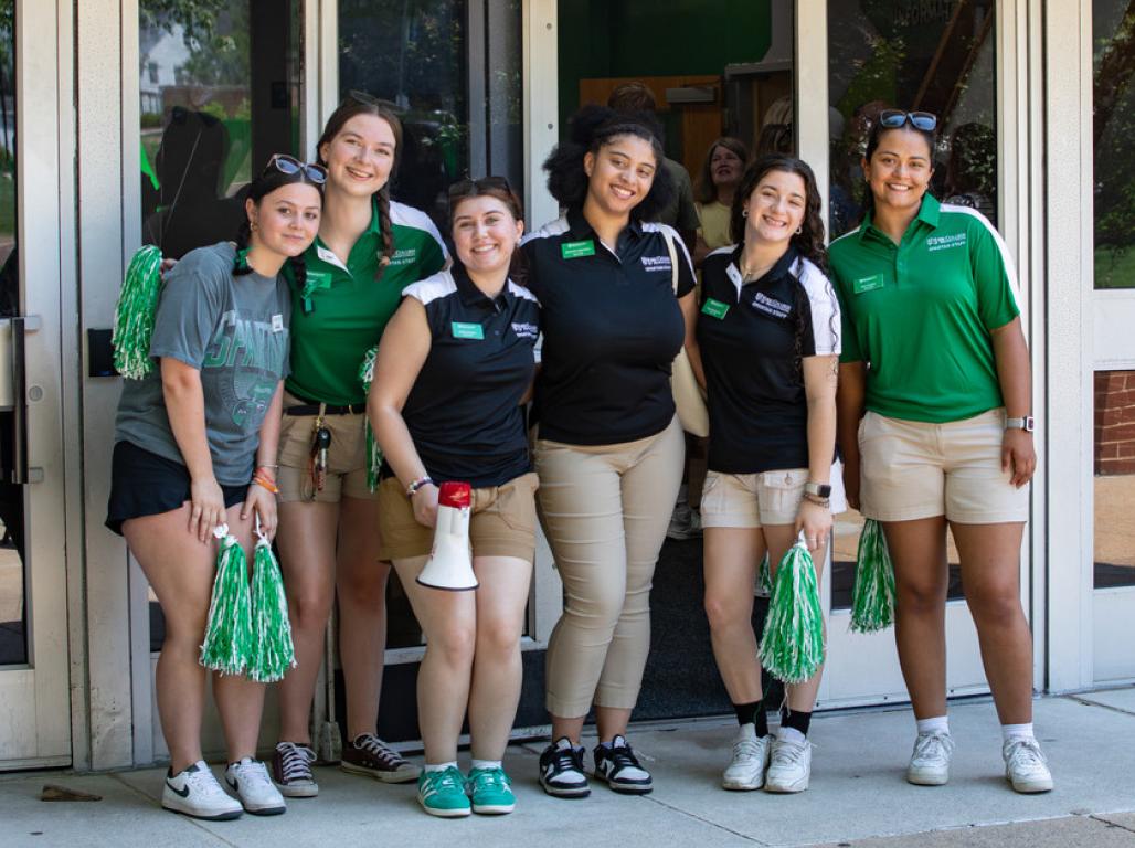 A group of student orientation leaders smile in a group at New Spartan Days
