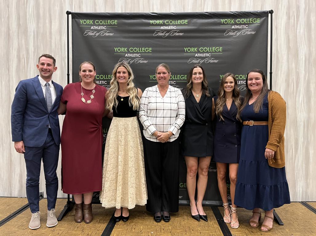 A group of people posing at a York College Athletic Hall of Fame event.
