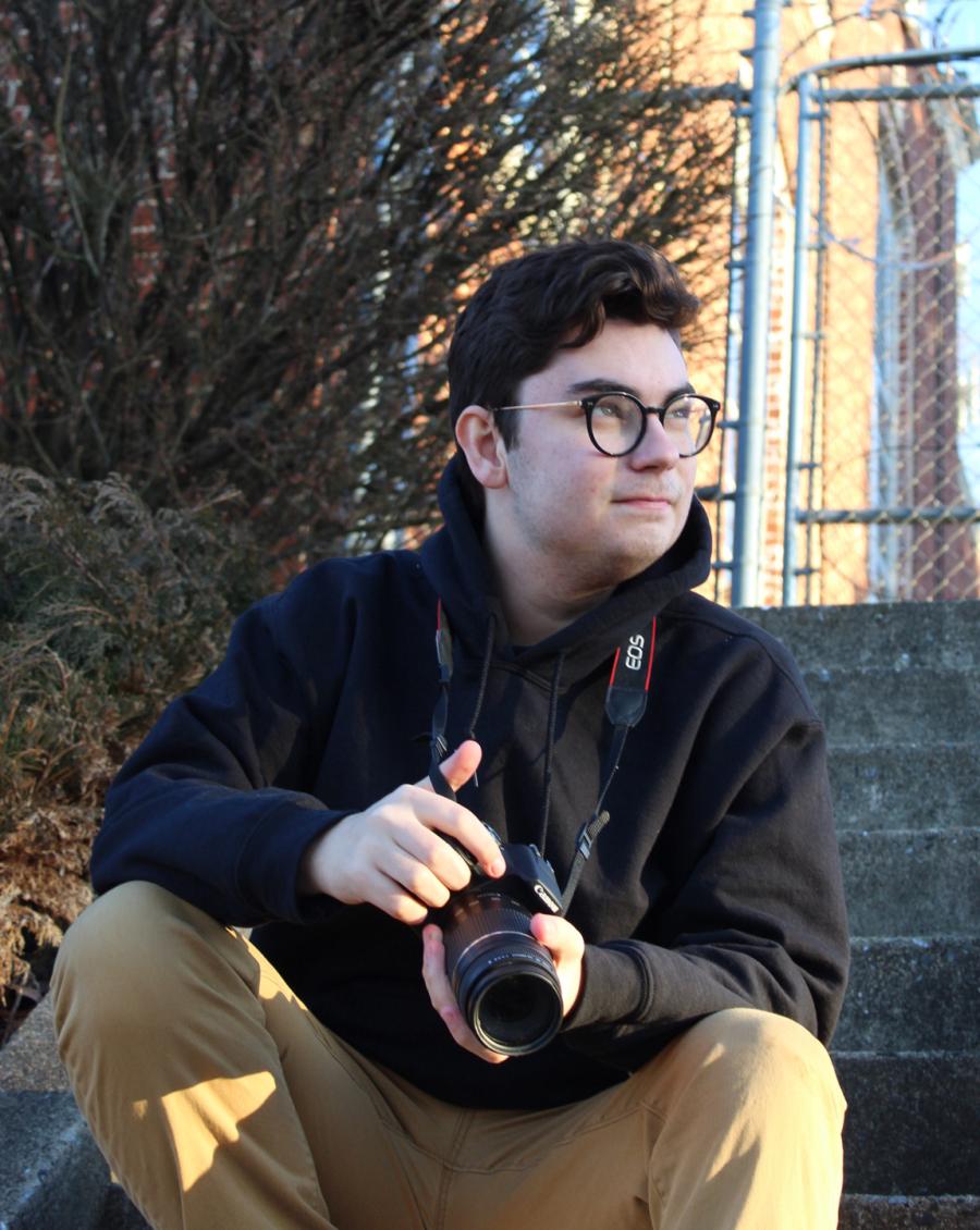 Chase Hellwig poses with his camera