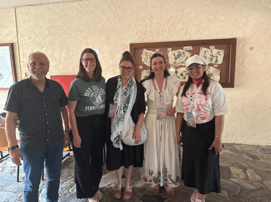 Erin Titter and Kristen Gurreri pose with Konstantinos “Kostas” Petridisin Greece for the York College international fundraising conference