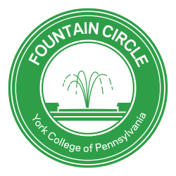 Fountain Circle logo: Green circle with graphic of campus fountain in the middle. Text around the outside reading "Fountain Circle. York College of Pennsylvania."