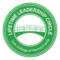 Lifetime Leadership Circle logo: Green circle with graphic of the York College bridge in the middle. Text around the outside reading "Lifetime Leadership Circle. York College of Pennsylvania."