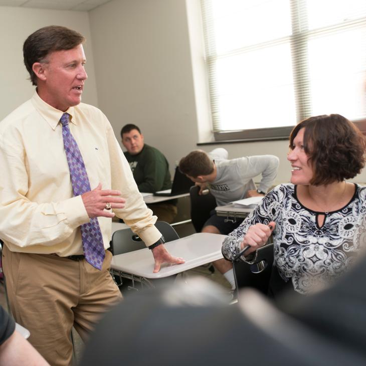 A professor teaching his class.