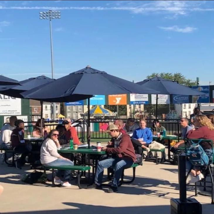 Students and mentors talking at PeoplesBank park.