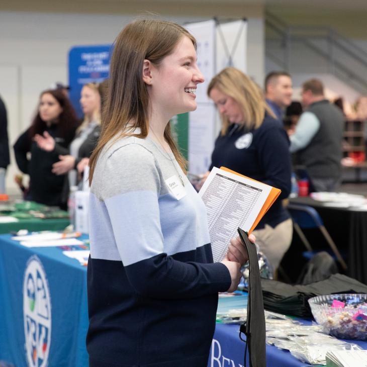 A student at the Career Expo speaking with a potential future employer.