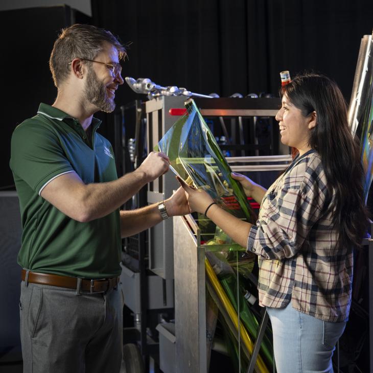 Two students talk in the TV studio